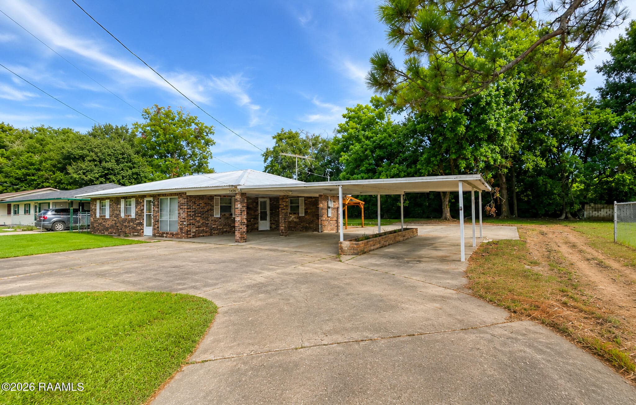 Front of home with covered parking